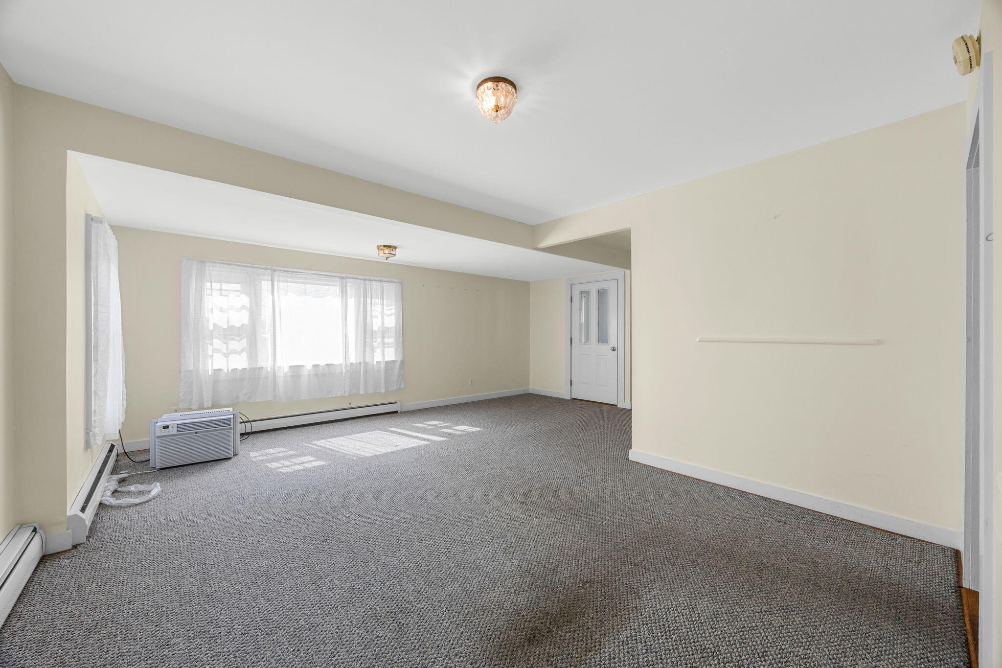 9 Harrison Avenue Buzzards Bay, MA 02532 - Photo 24 of 47 a view of empty room with windows
