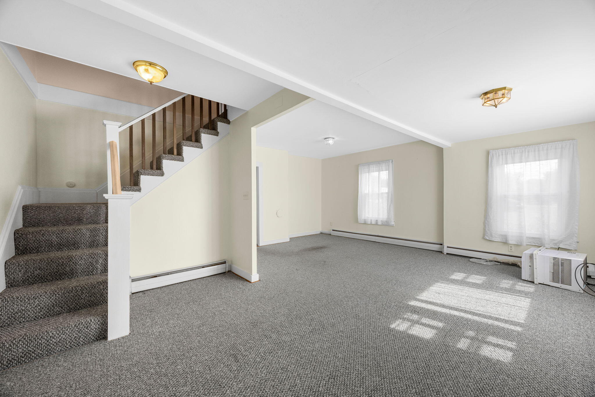 9 Harrison Avenue Buzzards Bay, MA 02532 - Photo 25 of 47 a view of an empty room with stairs and a window