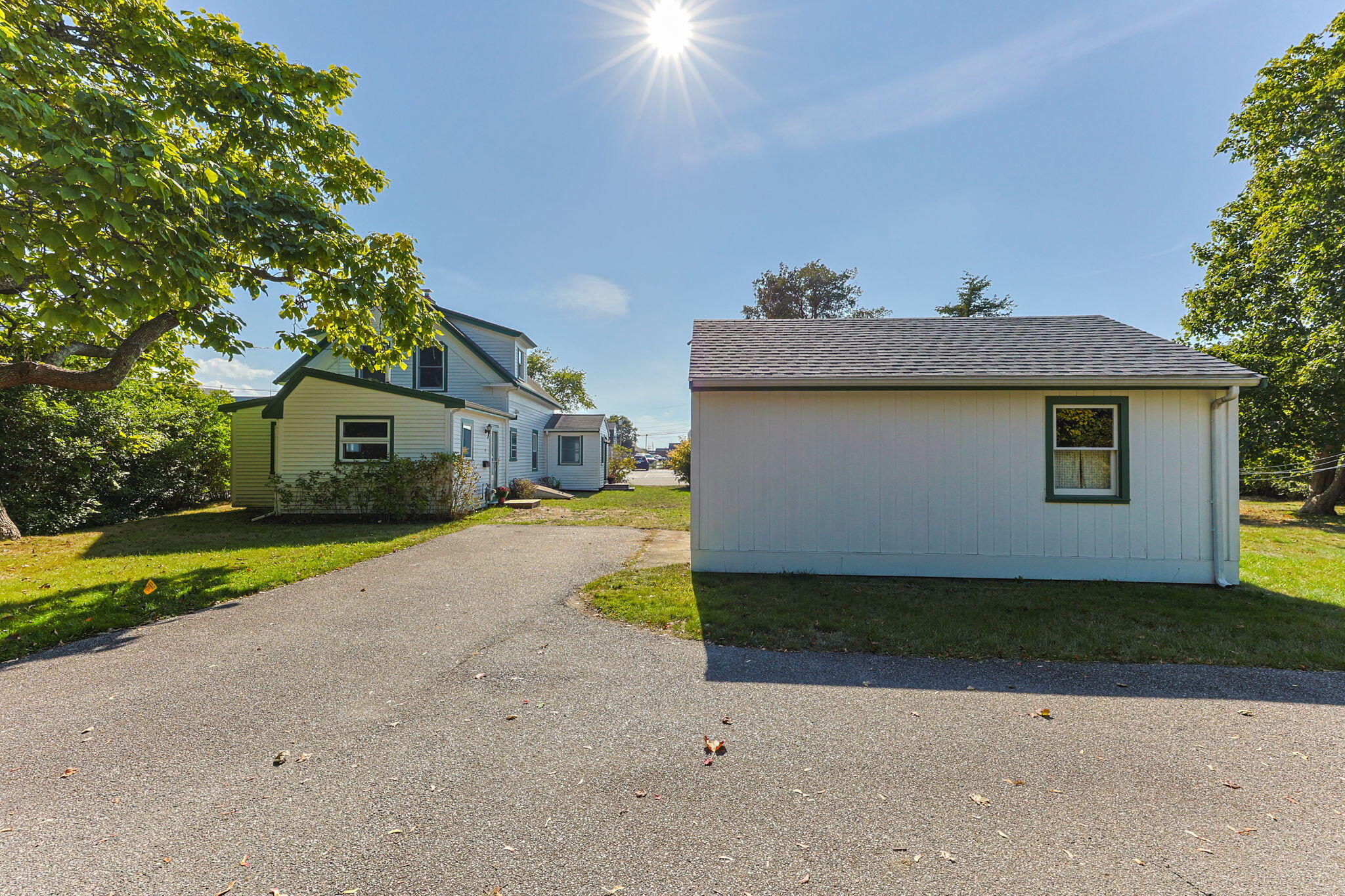 9 Harrison Avenue Buzzards Bay, MA 02532 - Photo 39 of 47 a front view of a house with a yard and garage