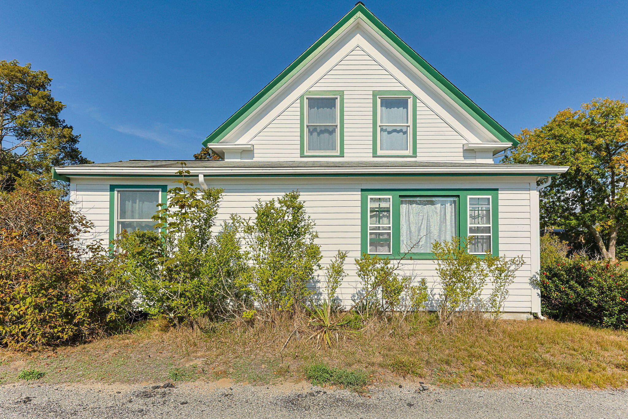 9 Harrison Avenue Buzzards Bay, MA 02532 - Photo 6 of 47 a front view of a house with a yard