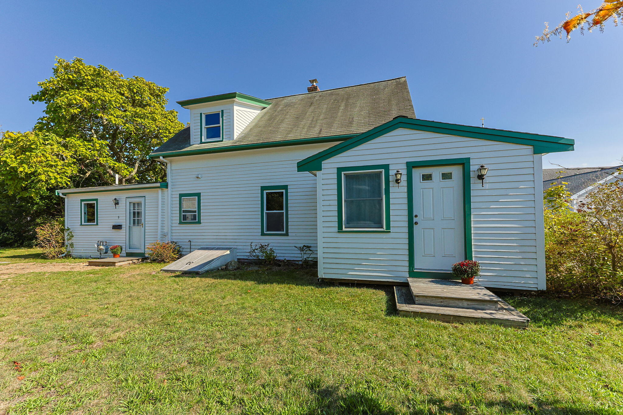 9 Harrison Avenue Buzzards Bay, MA 02532 - Photo 9 of 47 a backyard of a house with table and chairs