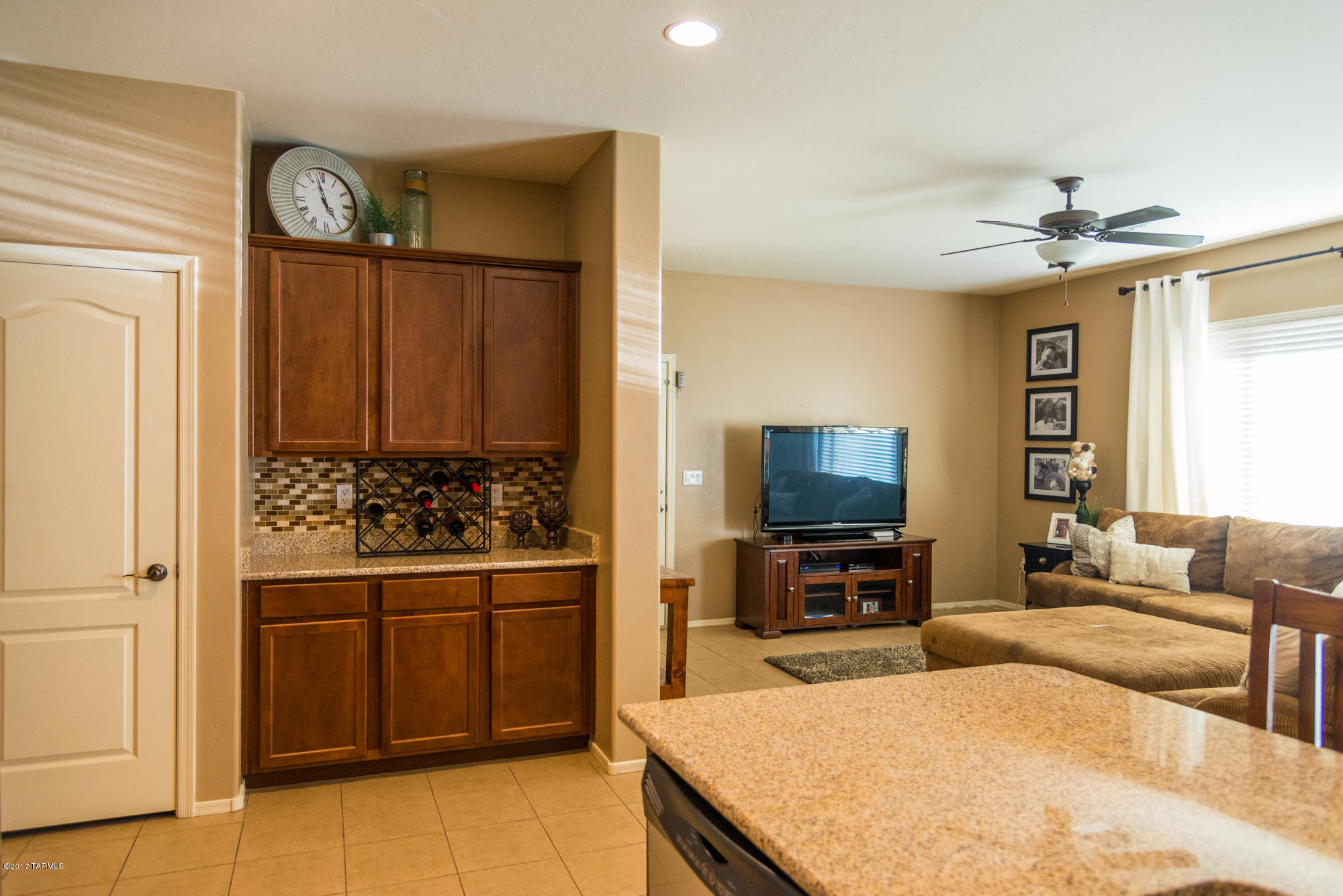 4405 West Crystal Ranch Place Marana, AZ 85658 - Photo 10 of 44 a living room with furniture and a flat screen tv