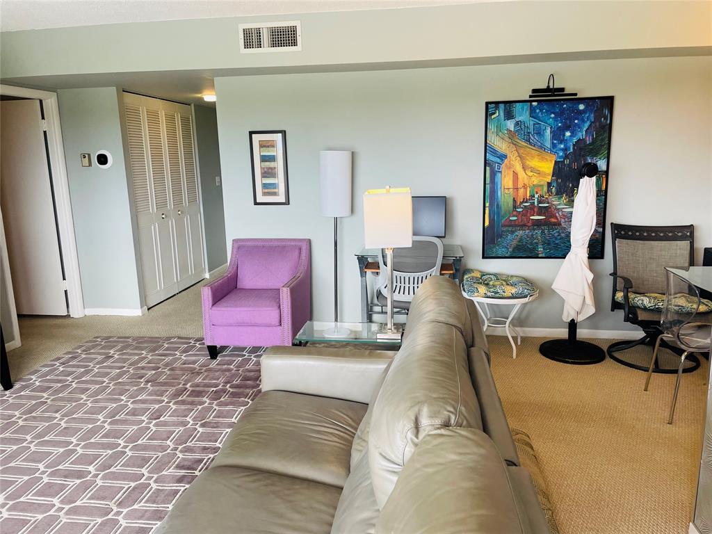 2500 Northeast 48th Lane, Unit 605 Fort Lauderdale, FL 33308 - Photo 12 of 32 a bed room with a bed and a chair