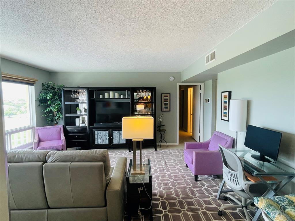 2500 Northeast 48th Lane, Unit 605 Fort Lauderdale, FL 33308 - Photo 13 of 32 a living room with furniture and floor to ceiling windows