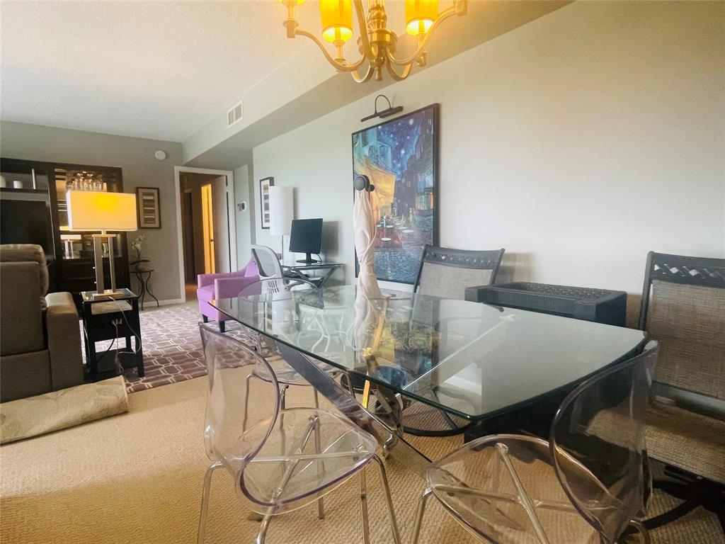 2500 Northeast 48th Lane, Unit 605 Fort Lauderdale, FL 33308 - Photo 15 of 32 a dining room with furniture and window