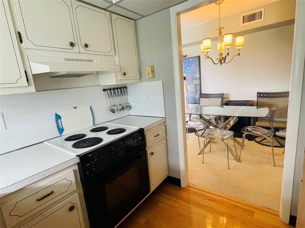 2500 Northeast 48th Lane, Unit 605 Fort Lauderdale, FL 33308 - Photo 18 of 32 a kitchen with stainless steel appliances granite countertop a stove a sink and a refrigerator