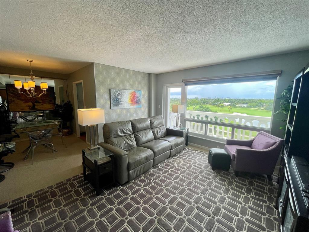 2500 Northeast 48th Lane, Unit 605 Fort Lauderdale, FL 33308 - Photo 2 of 32 a living room with furniture and a large window
