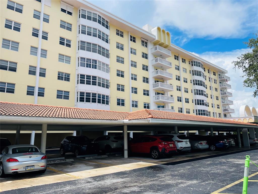 2500 Northeast 48th Lane, Unit 605 Fort Lauderdale, FL 33308 - Photo 32 of 32 a view of a building with car parked