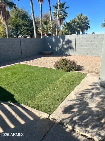 a view of backyard with swimming pool