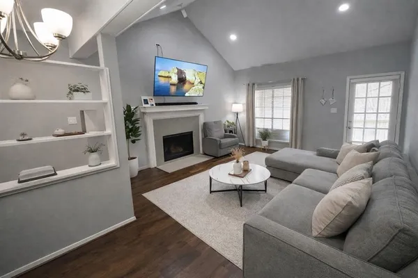 a living room with furniture and a fireplace