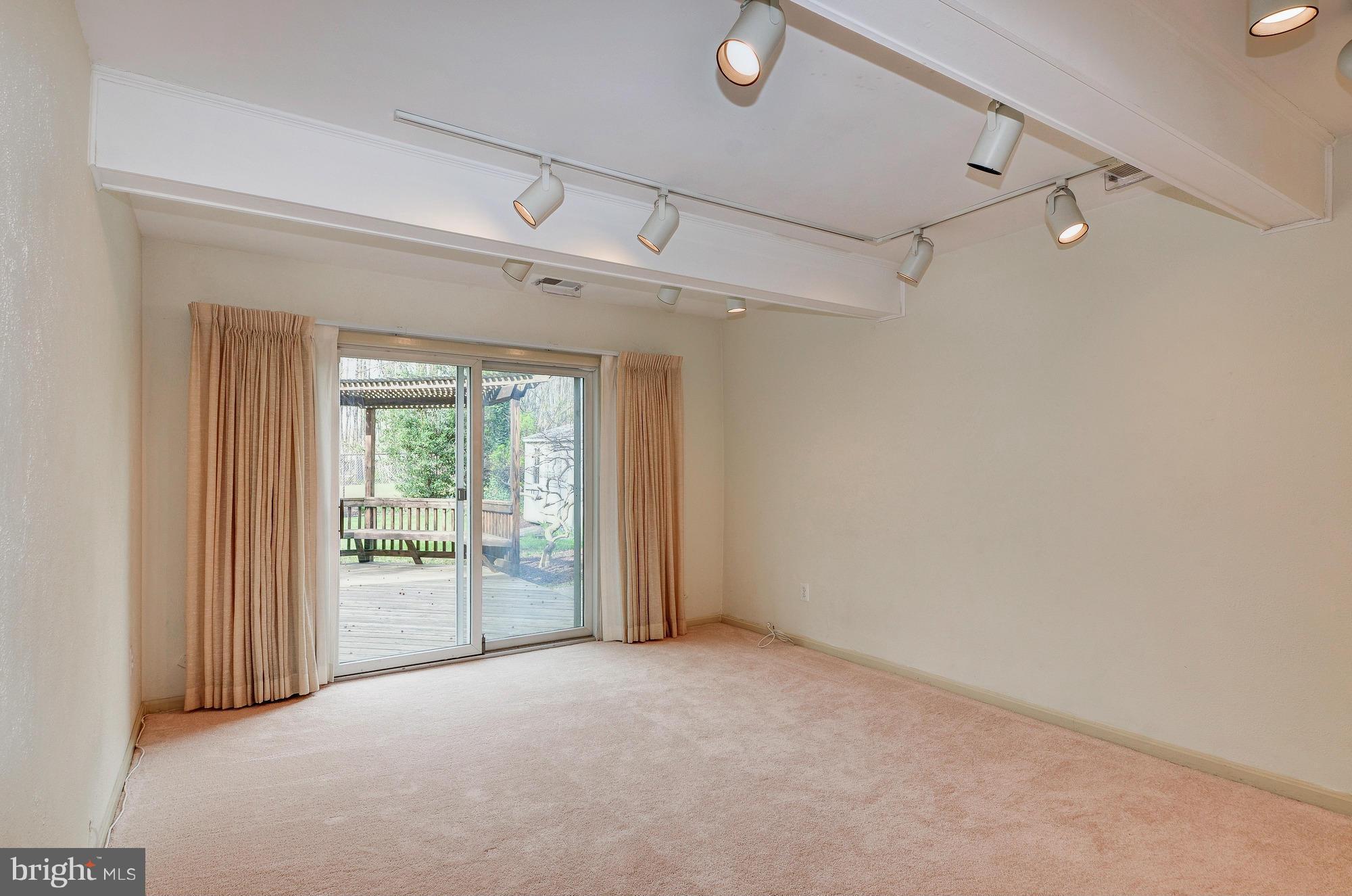 5514 Dunsmore Road Alexandria, VA 22315 - Photo 11 of 30 Family Room with New Carpet and Sliding Glass Door