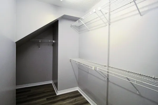a bathroom with a shower a sink and a mirror