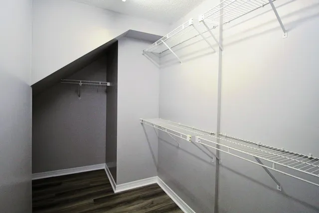 a bathroom with a shower a sink and a mirror