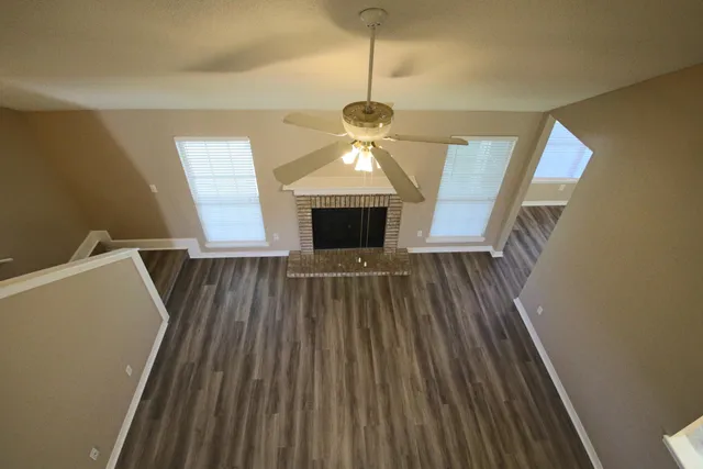 a view of gallery with wooden floor