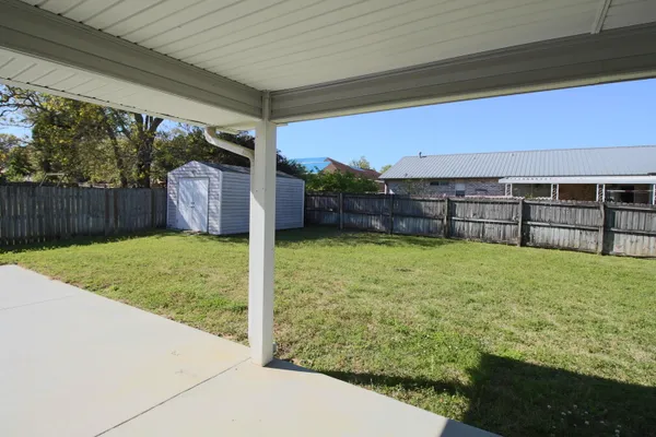 a view of outdoor space and backyard