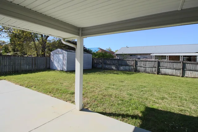 a view of outdoor space and backyard