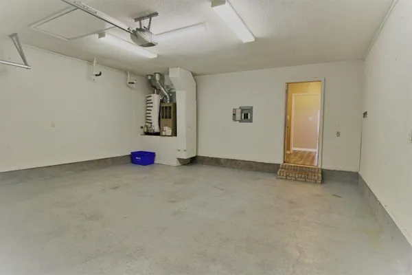 a view of room with wooden floor