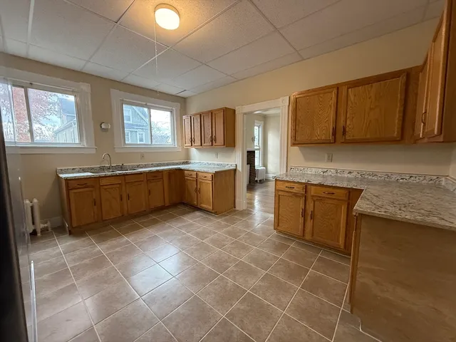 a large kitchen with a cabinets and sink