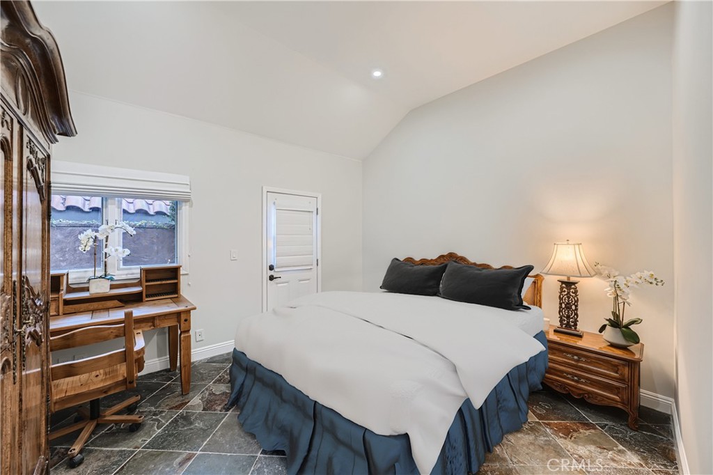 371 22nd Street Costa Mesa, CA 92627 - Photo 19 of 51 a bedroom with a bed and a piano