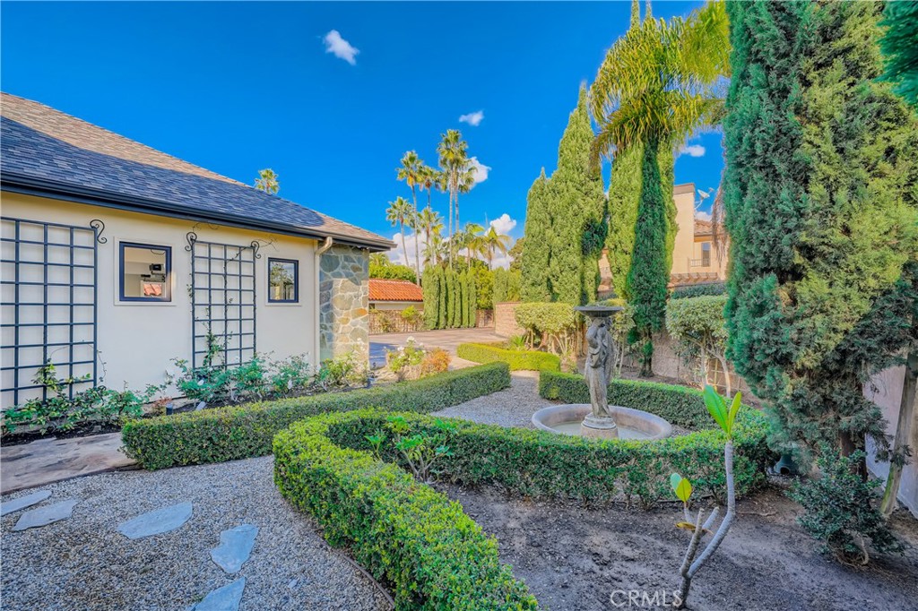 371 22nd Street Costa Mesa, CA 92627 - Photo 28 of 51 a front view of a house with a yard