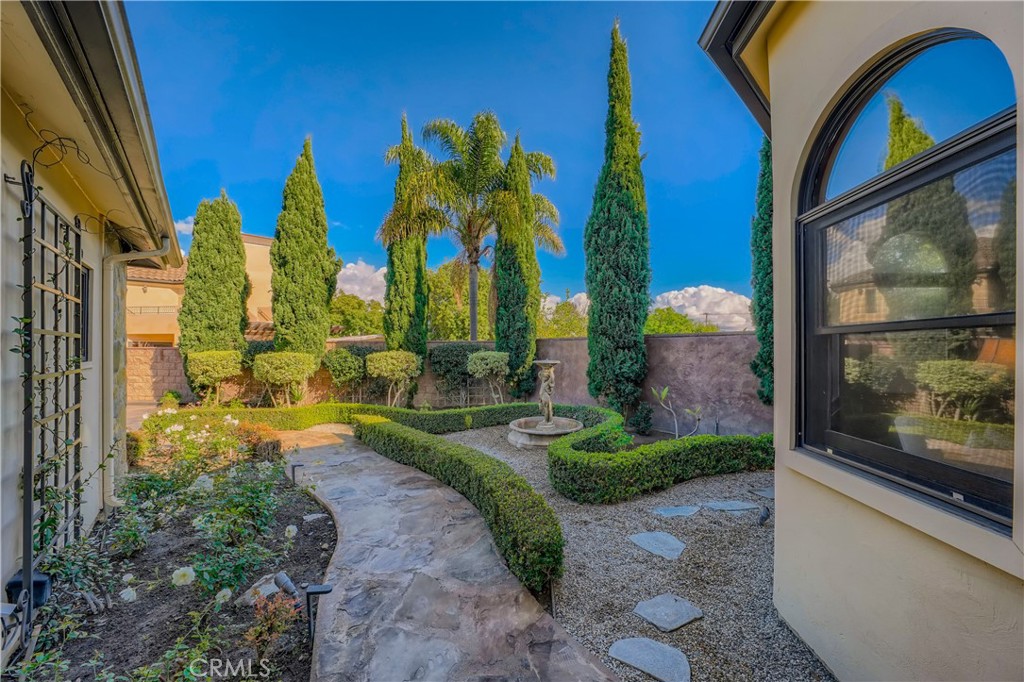 371 22nd Street Costa Mesa, CA 92627 - Photo 30 of 51 a view of a garden with a building in the background