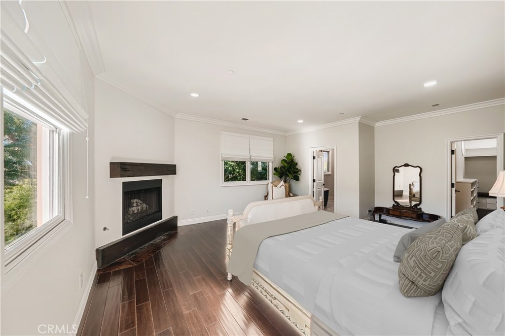 371 22nd Street Costa Mesa, CA 92627 - Photo 32 of 51 a bedroom with a bed and a fireplace