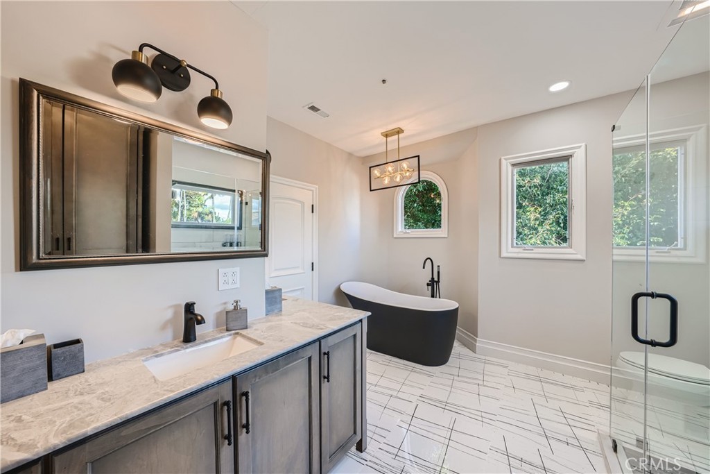371 22nd Street Costa Mesa, CA 92627 - Photo 33 of 51 a bathroom with a sink and a mirror