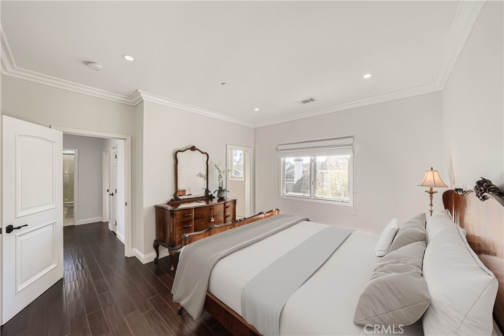 371 22nd Street Costa Mesa, CA 92627 - Photo 36 of 51 a bedroom with a bed and a large mirror