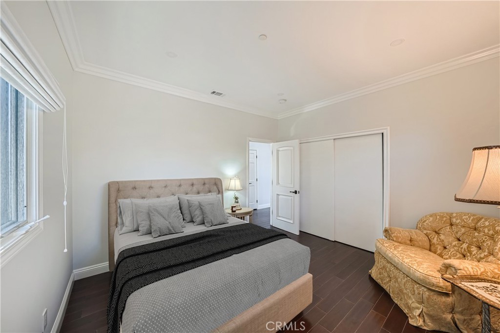 371 22nd Street Costa Mesa, CA 92627 - Photo 39 of 51 a bedroom with a bed and couch