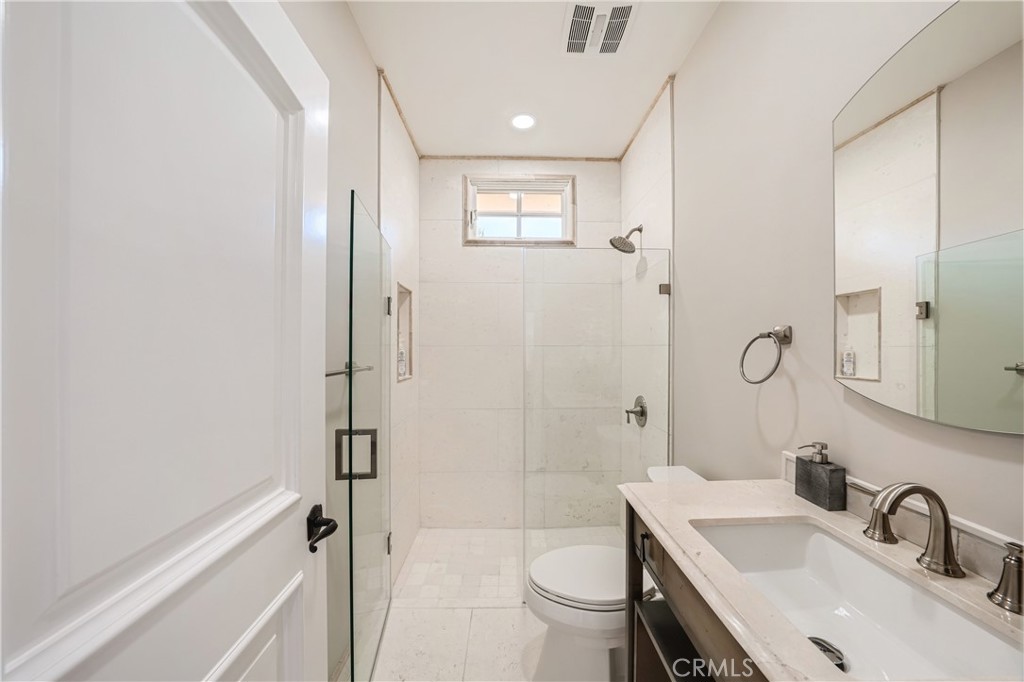 371 22nd Street Costa Mesa, CA 92627 - Photo 40 of 51 a bathroom with a sink toilet and shower
