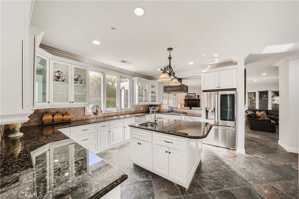 371 22nd Street Costa Mesa, CA 92627 - Photo 8 of 51 a kitchen with a sink stove and cabinets