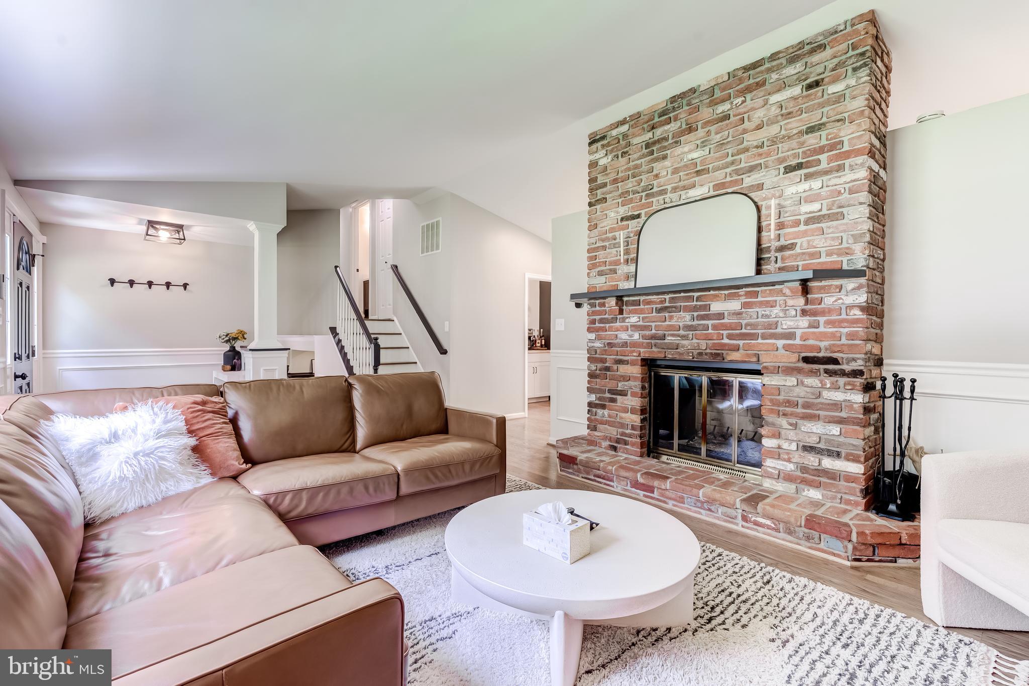 11926 Appling Valley Road Fairfax, VA 22030 - Photo 35 of 60 a living room with furniture and a fireplace