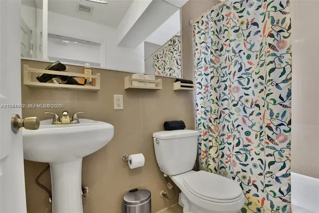 a bathroom with a toilet and a sink