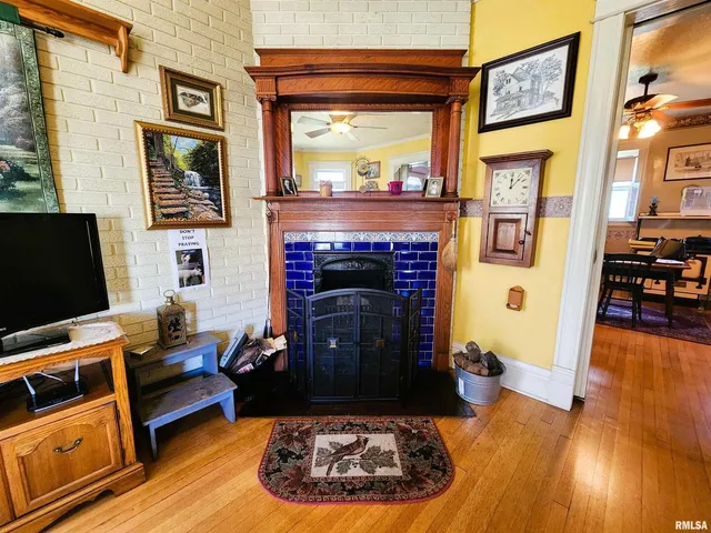 a living room with furniture and a fireplace