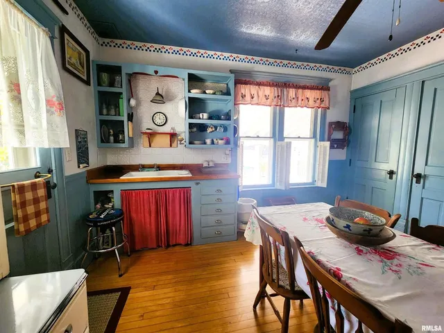a view of a dining room with furniture and window