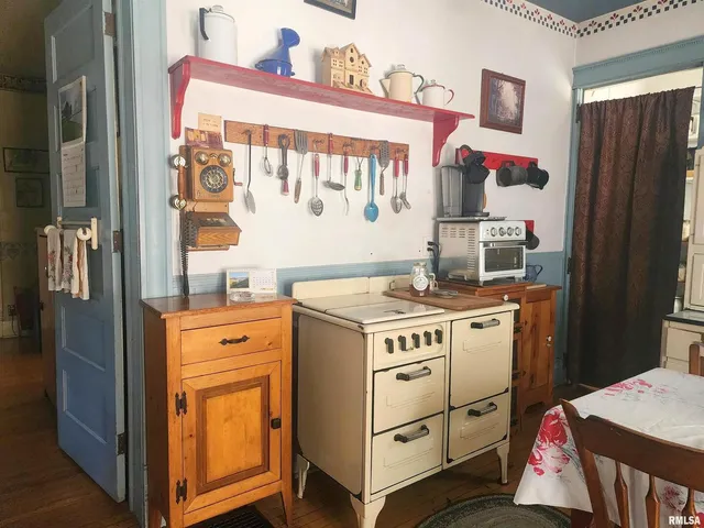 a kitchen with a stove and cabinets