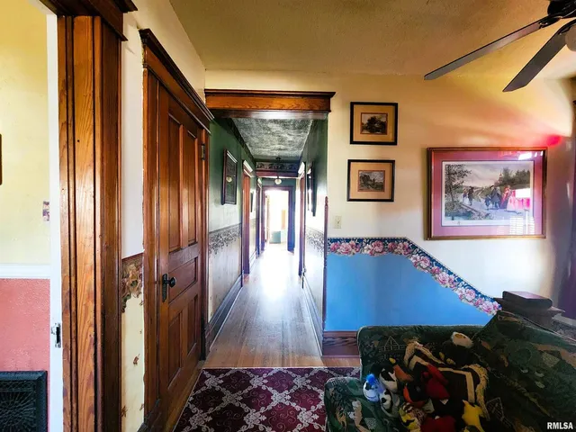 a view of a livingroom with furniture and staircase