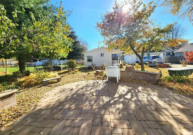 a view of a patio with a yard