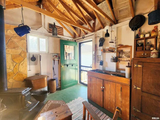 a kitchen with stainless steel appliances granite countertop a stove a sink dishwasher and a refrigerator with wooden floor