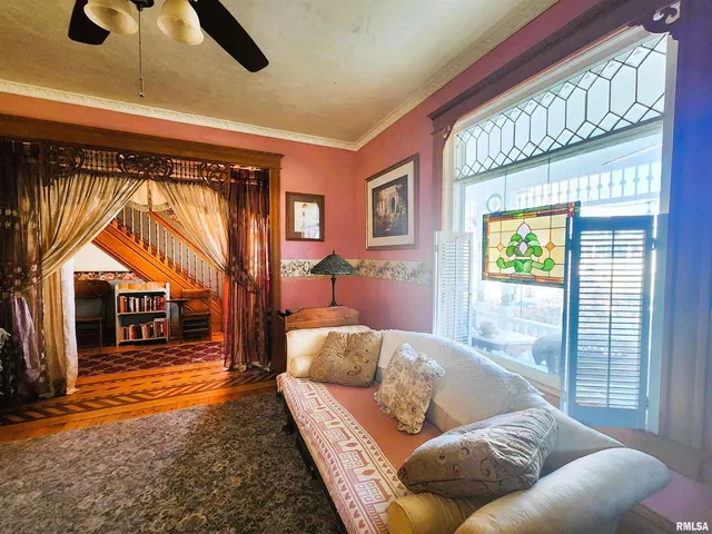 a living room with furniture and a window