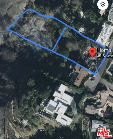 a living room with patio furniture and a large window