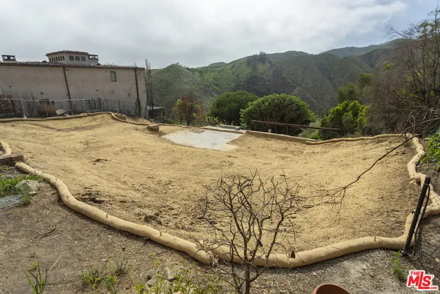 a view of a yard with an outdoor space