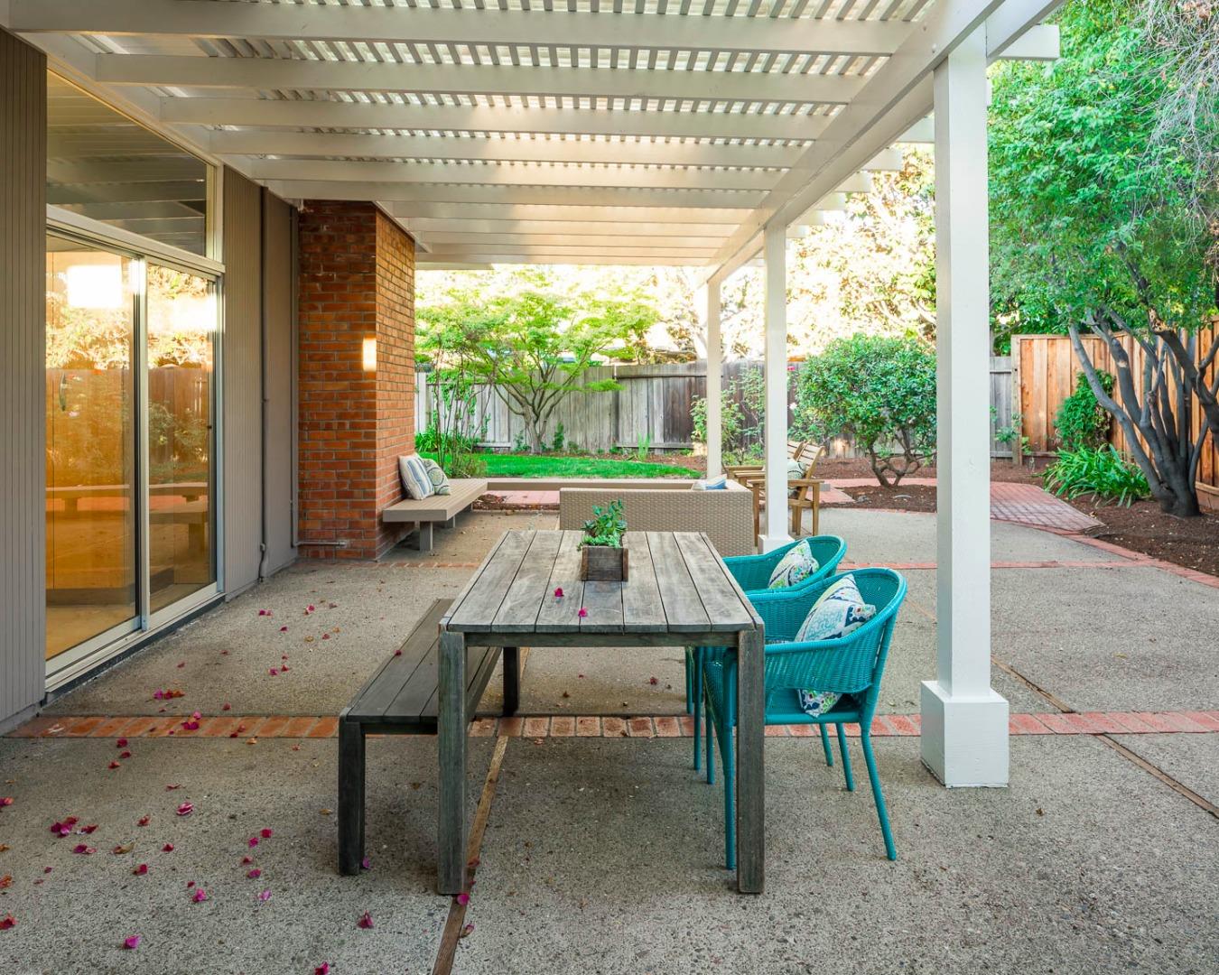 3441 Thomas Drive Palo Alto, CA 94303 - Photo 11 of 14 a backyard of a house with a table and chairs
