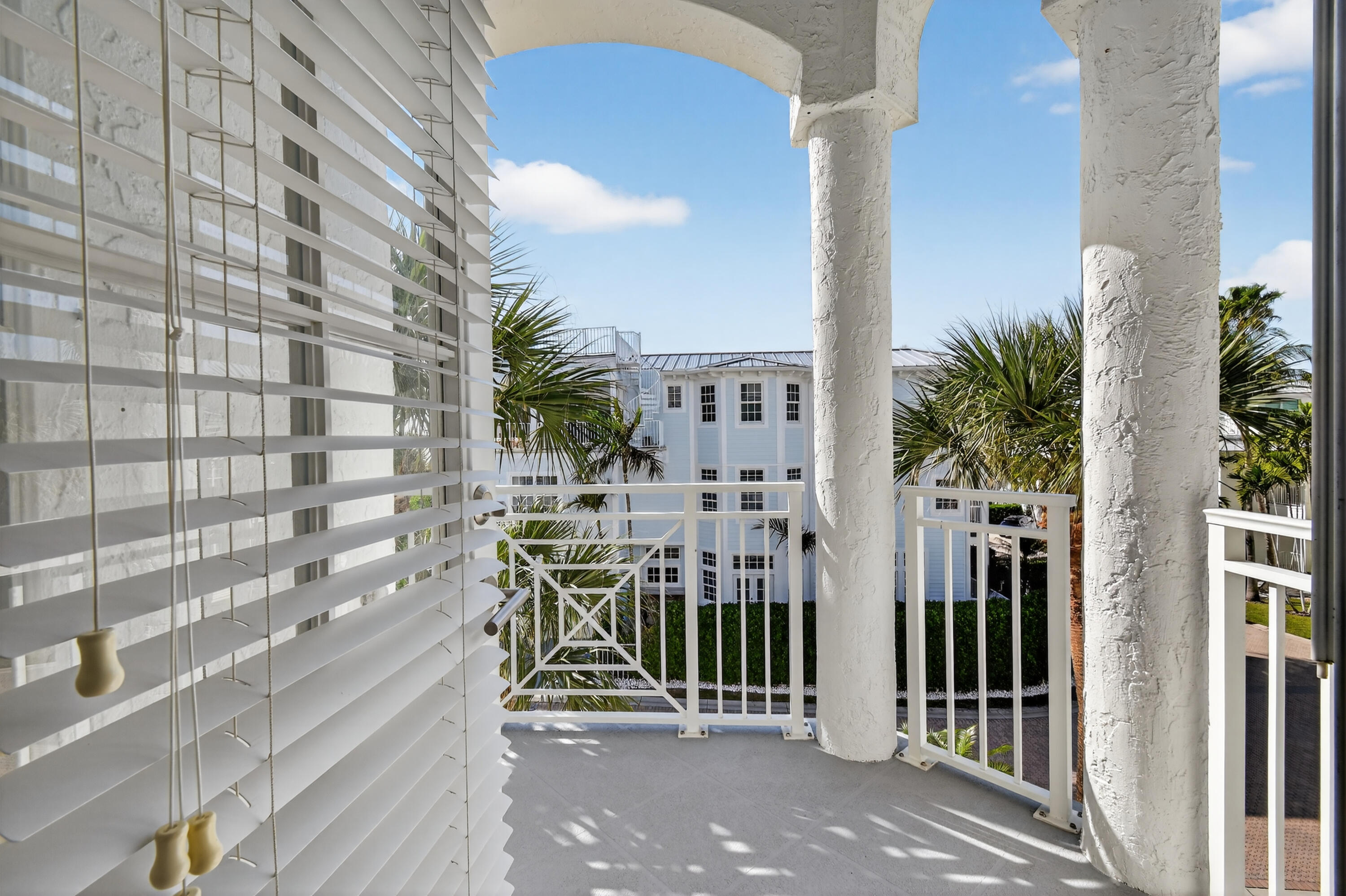 115 Ocean Key Way Jupiter, FL 33477 - Photo 13 of 45 a view of a balcony with potted plants