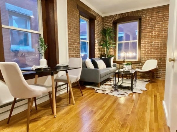 11 Unity Street, Unit 6 Boston, MA 02113 - Photo 1 of 12 a view of a patio with table and chairs