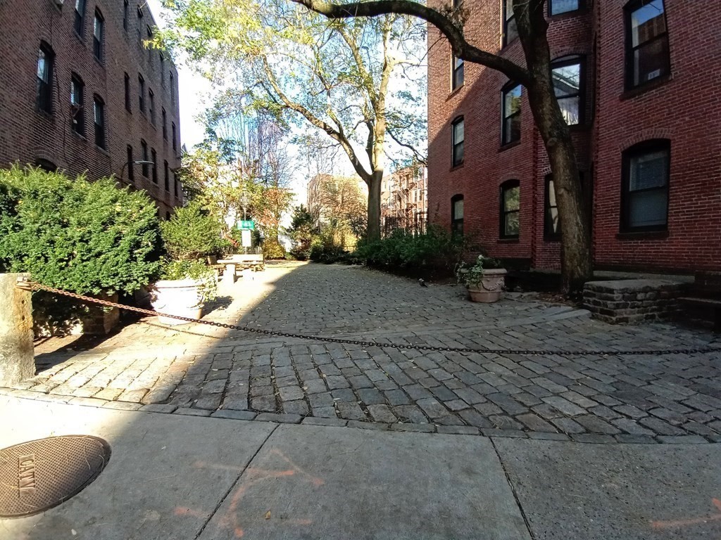 11 Unity Street, Unit 6 Boston, MA 02113 - Photo 11 of 12 a view of a backyard of the house