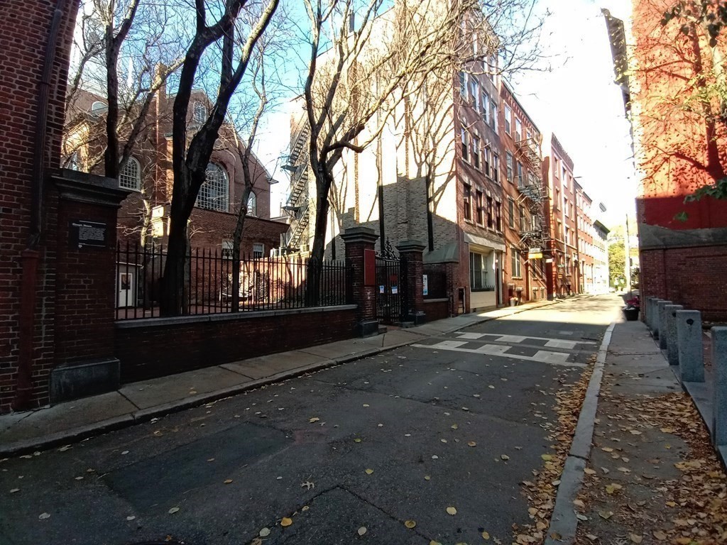 11 Unity Street, Unit 6 Boston, MA 02113 - Photo 10 of 12 a street view with large trees