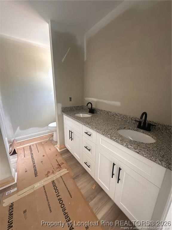 151 Merle Road Pinebluff, NC 28373 - Photo 2 of 6 a kitchen with granite countertop white cabinets and a sink