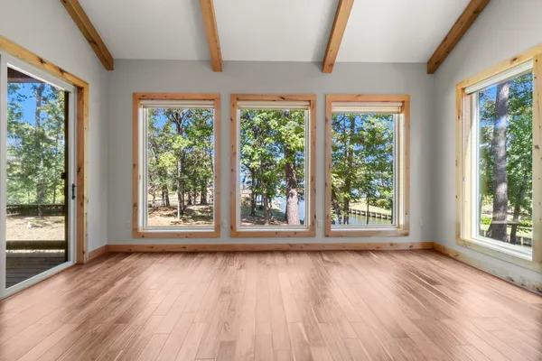 a spacious bathroom with a granite countertop sink a mirror and a