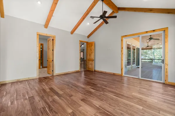 a large kitchen with stainless steel appliances granite countertop a large window
